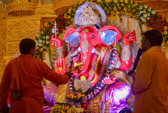 Lucknow: Devotees offer prayers to Lord Ganesha on the occasion of Ganesh Chaturthi at Jhulelal Vatika, in Lucknow, Uttar Pradesh, on Monday, September 14, 2026.