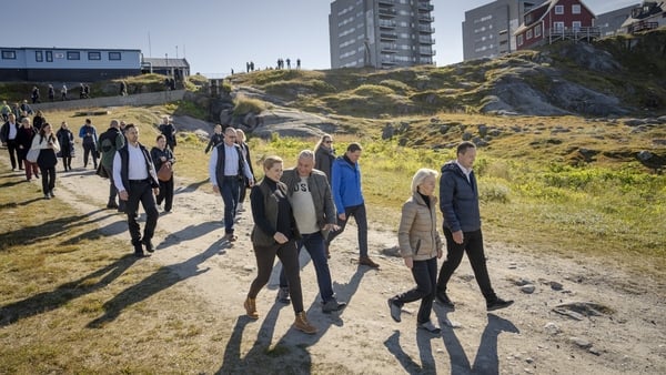 Officials walk through the streets of Nuuk, Greenland